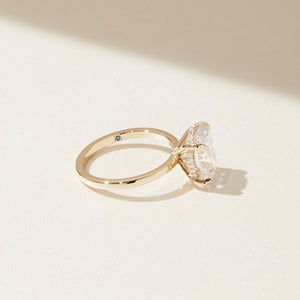 gold oval engagement ring close up 