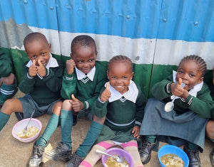 Nia children eating together                             